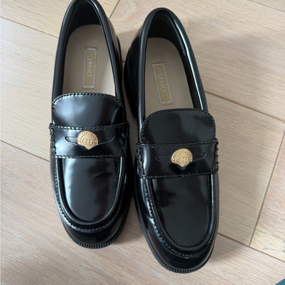 Black Patent Leather Loafers with Gold Medallion